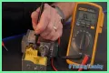 How do you test a Honeywell gas valve with a multimeter?